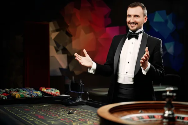 A glowing roulette wheel with cascading chips, symbolizing the engaging live and instant-win games available on 33L.